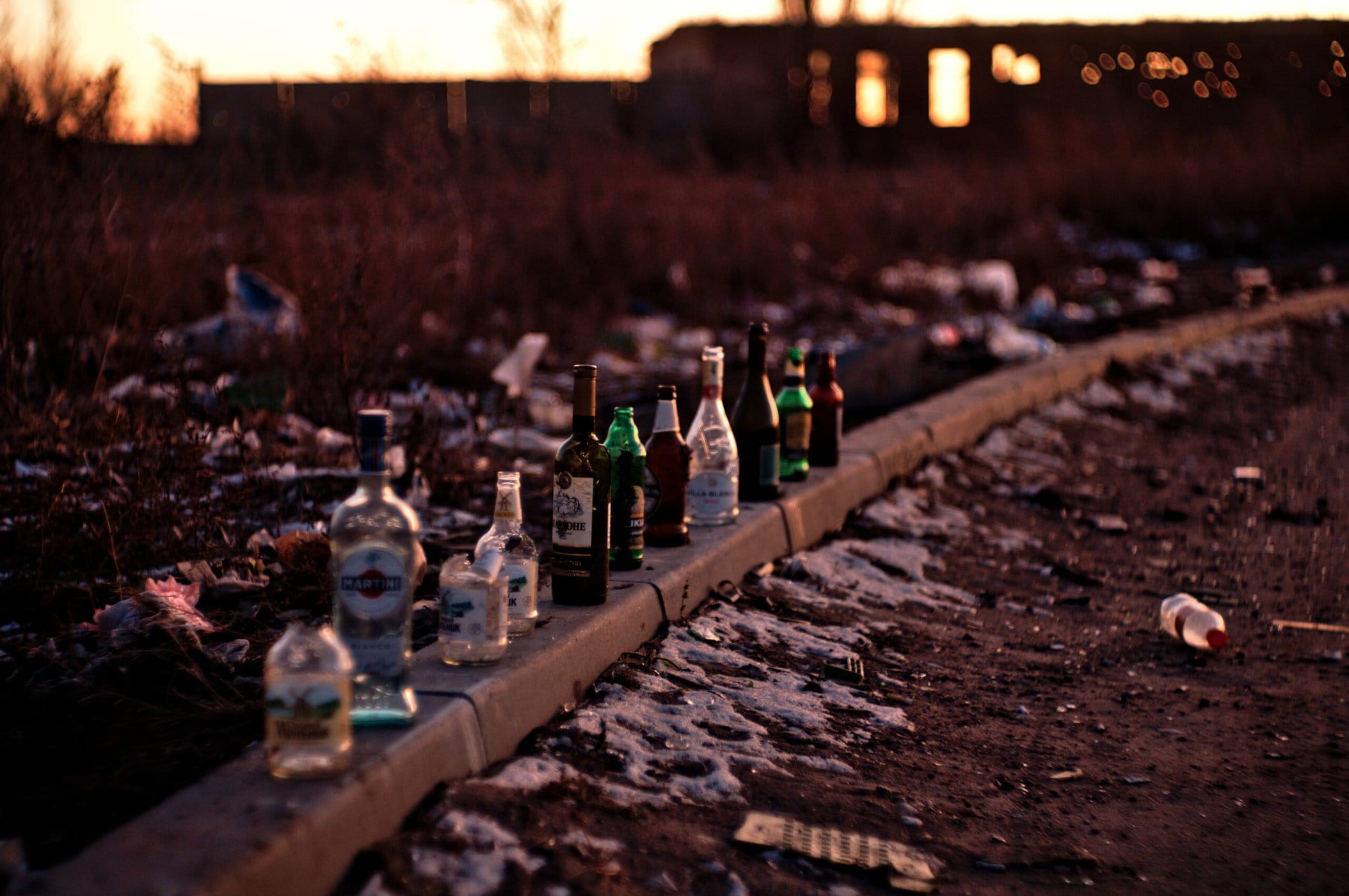 An image of alcohol bottles on the ground.