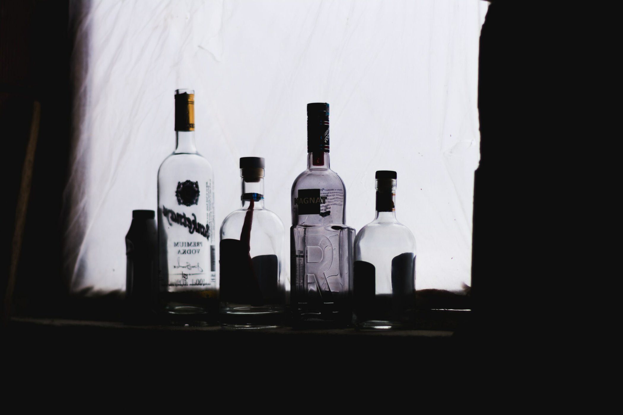 An image of empty alcohol bottles.